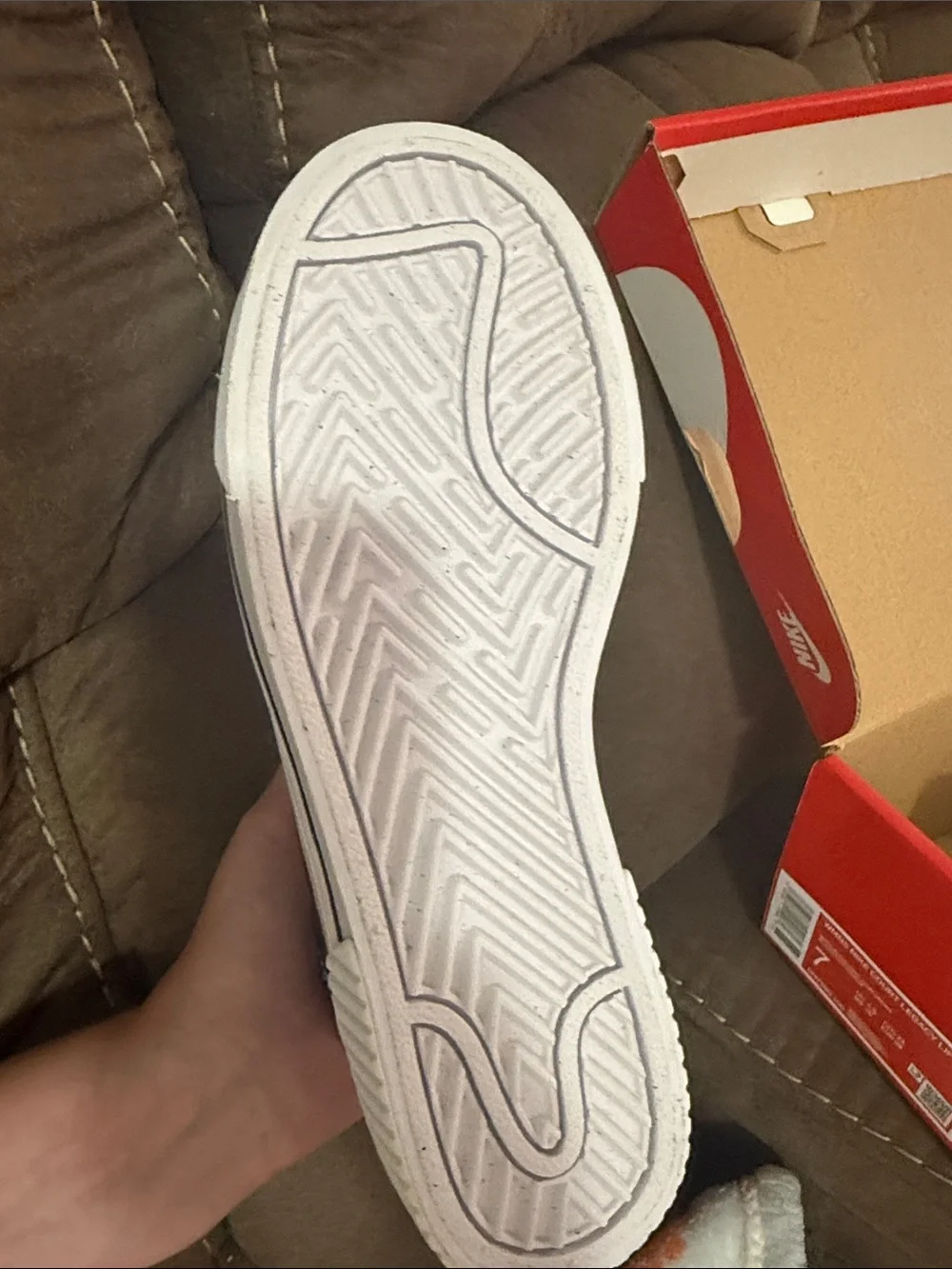 Nike Women's White Sneakers with Black Swoosh and Tan Stripe
